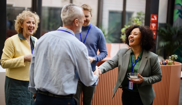 Conference speakers handshaking after presentation at the convention center